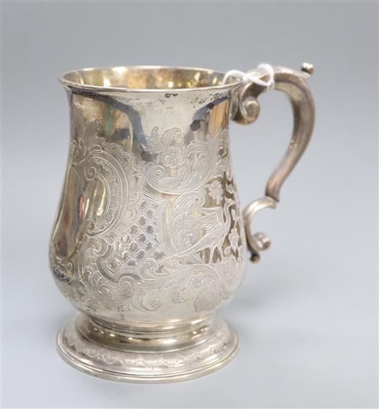 A George II silver baluster mug, with later engraved decoration, Thomas Gilpin, London, 1748, 12 oz.